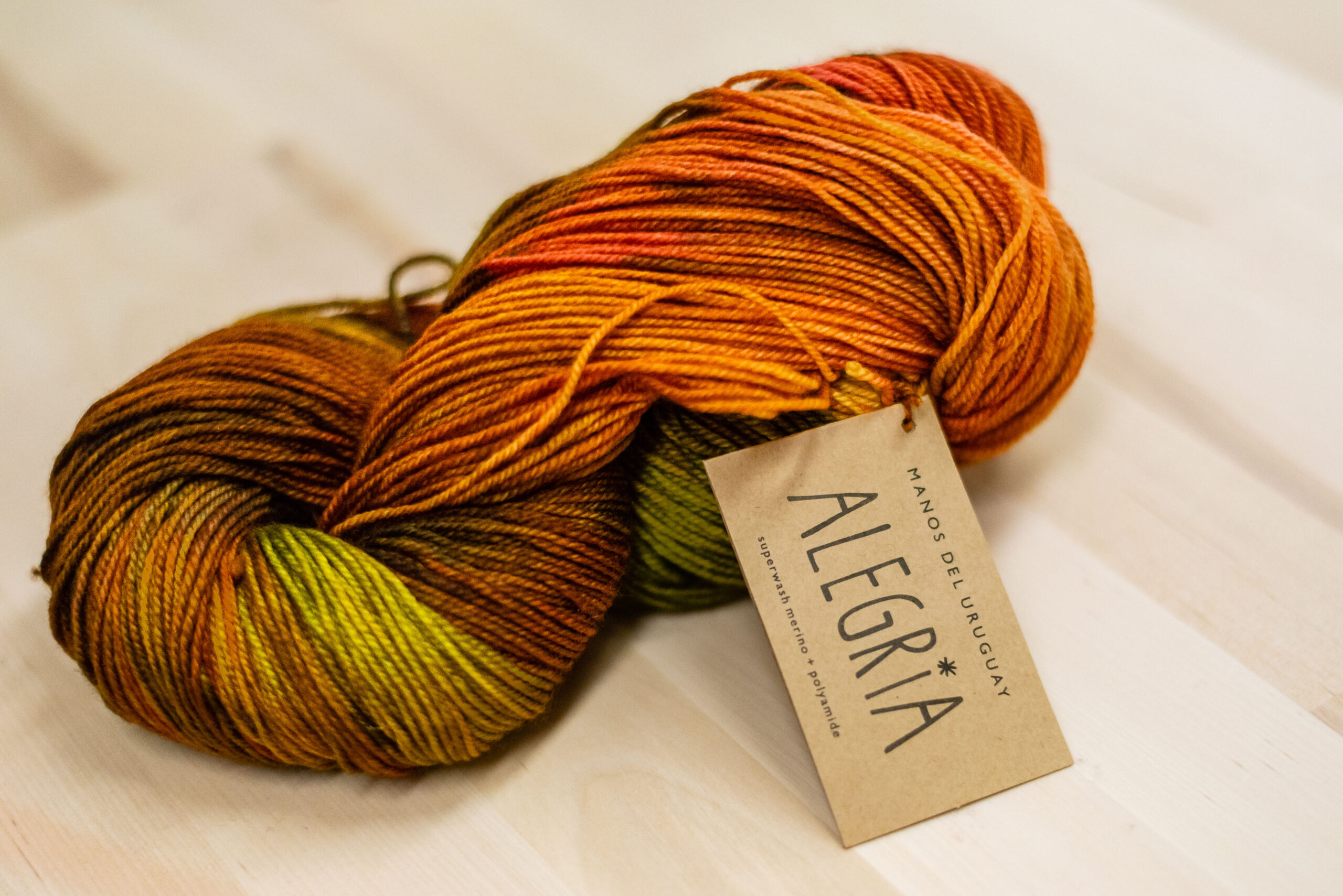 Allegria Strickgarn in Verlaufsfarben orange/grün/braun